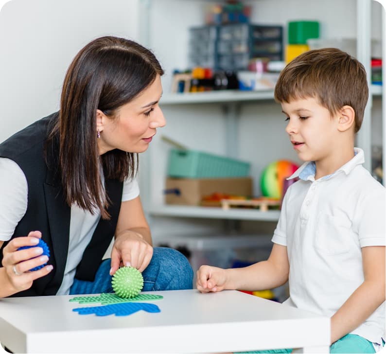 Speech-language pathologist with patient